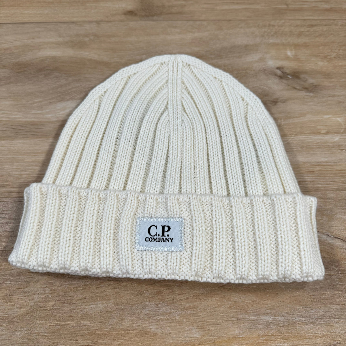 C.P. Company Extra Fine Merino Wool Logo Beanie in Gauze White