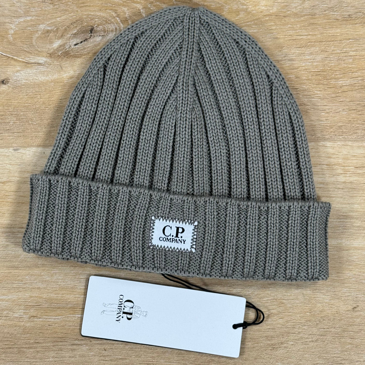 C.P. Company Extra Fine Merino Wool Logo Beanie in Fallen Rock - Beige