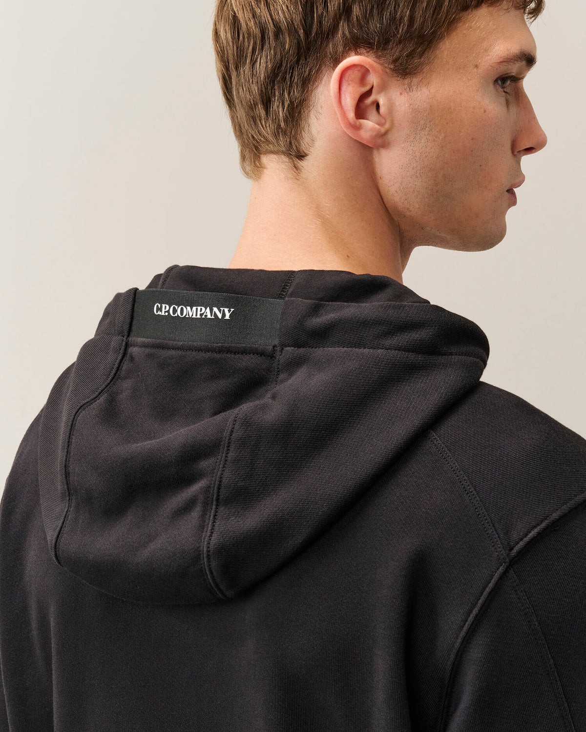 C.P. Company Diagonal Raised Fleece Lens Hoodie in Black