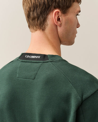 C.P. Company Diagonal Raised Fleece Crewneck Lens Sweatshirt in Ponderosa Pine - Green
