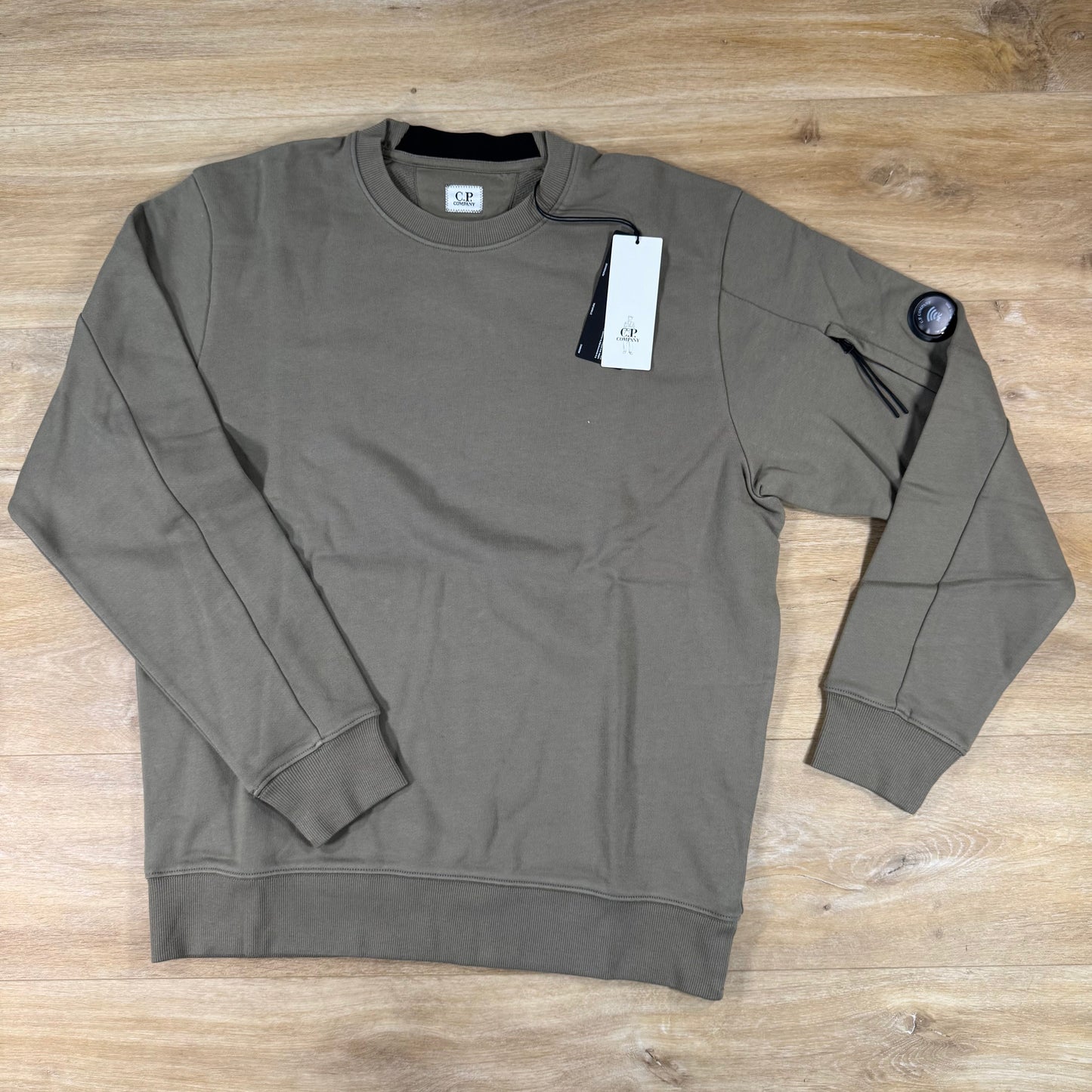 C.P. Company Diagonal Raised Fleece Crewneck Lens Sweatshirt in Fallen Rock - Beige